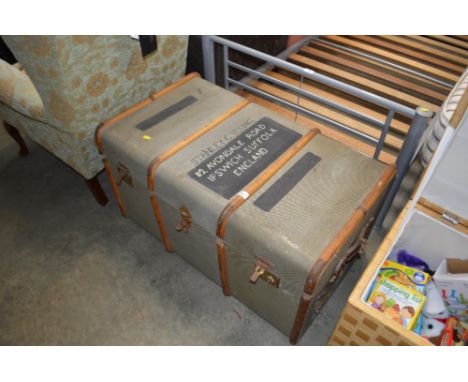 A wooden bound travelling trunk