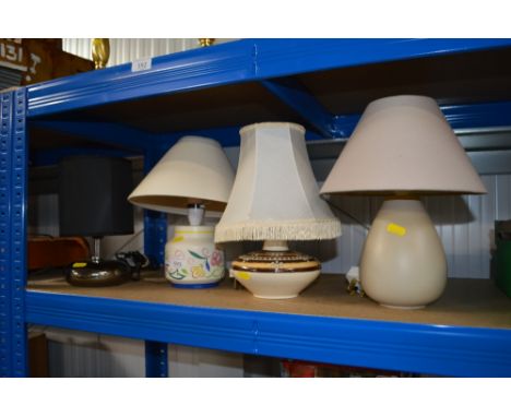 A Poole table lamp and shade together with three others