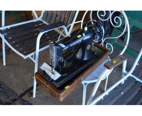 A Singer sewing machine, sold as a collector's item