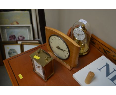 An Anniversary clock together with two mantel clocks