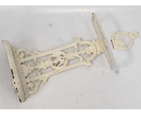 A white painted cast iron stick stand. With pierced and moulded foliate decoration, 60cm high (AF)