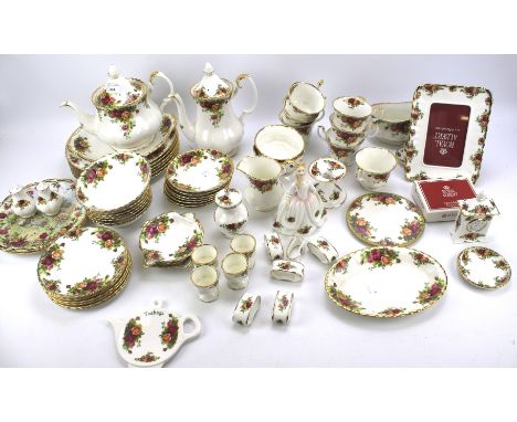 A large collection of Royal Albert Old Country Roses tea wares. Including tea and coffee pot, cups, egg cups, small table clo