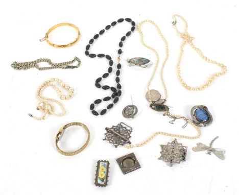 An assortment of costume jewellery. Including brooches, silver belt buckle, fob chain, Timex watch, etc