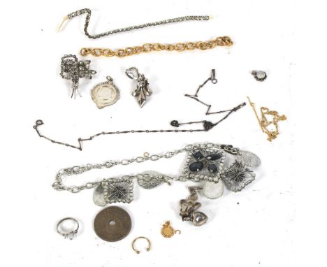 An assortment of costume jewellery. Including brooches, a pendant, chain, pair of earrings, etc