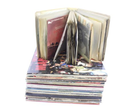 A collection of vintage vinyl records and albums. To include Buddy Holly and the Beach Boys, the majority in the original sle