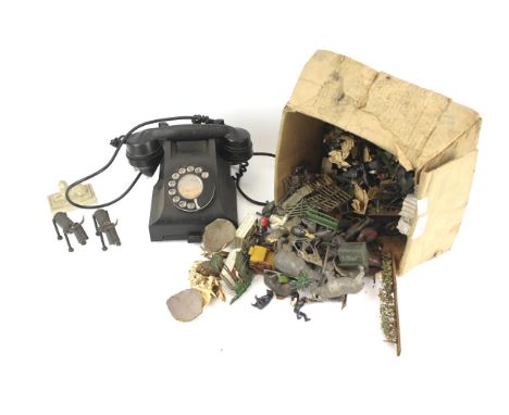 A vintage black telephone and assorted plastic and painted lead figures. Including Britains examples