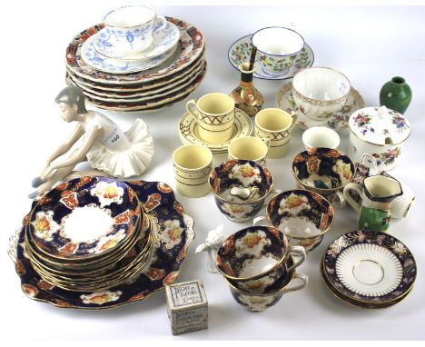 An assortment of ceramics. To include a Nao figure of a ballerina, two Mintons porcelain tea cups with saucers, Dresden tea c