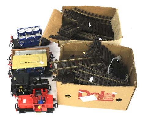 An assortment of vintage Playmobil trains and related accessories. To include a 99501 locomotive, carriages, track, etc