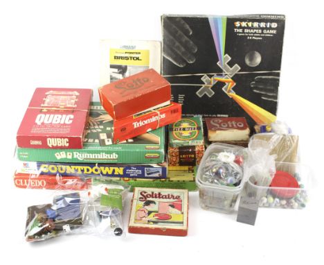 An assortment of vintage games and marbles. To include Cluedo, Rummikub and Lexicon