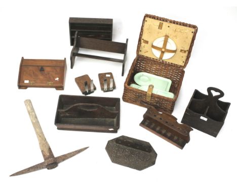 A large assortment of wooden wares. To include a wooden book trough, pipe rack, wicker basket, pick axe, etc