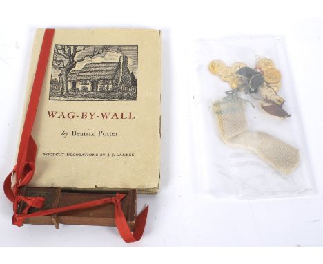 A Beatrix Potter book 'Wag by Wal'l and assortment of Christmas related novelties. The book a First Edition, published The Ho