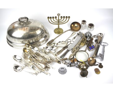 An assortment of silver plated wares. To include a large meat dome, serving ladle, Garrard &amp; Co flatware, etc