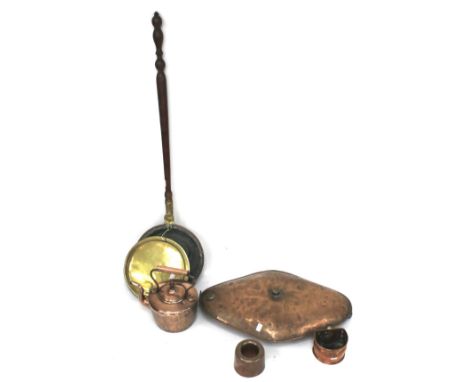 An early 19th century copper and brass mounted bed warming pan and other items of copper. The first with wooden turned balust
