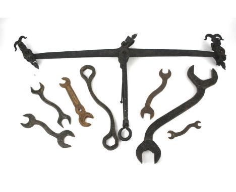 An assortment of vintage tools. Including a set of scales and hand forged railway/traction engine spanners
