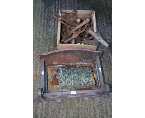 A cast iron fire grate and an assortment of vintage farm implements. The grate L75cm including supports