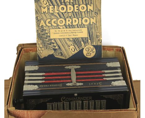 An early 20th century Art Deco Commander accordion. Housed in original box, made in Germany