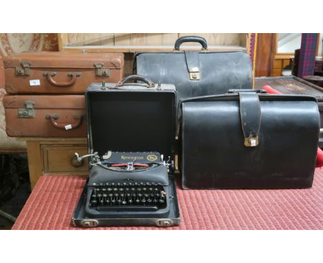 A lot comprising four assorted leather suitcases and a cased Remington typewriter (5) Condition Report:Available upon request