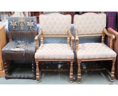 A lot comprising a pair of 20th century gilt framed theatre seats with beige geometric upholstery, scrolled arms on turned su
