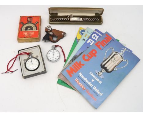 A London silver ID bracelet, two stopwatches by Heuer, four various football programmes and a pistol cigarette lighter Condit