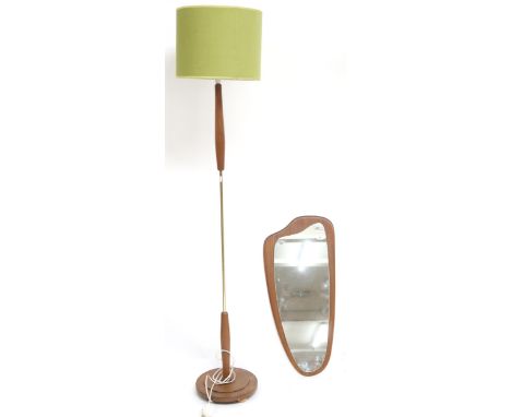 A mid 20th century brass and teak standard lamp with green linen shade on stepped circular base, 172cm high and a mid 20th ce