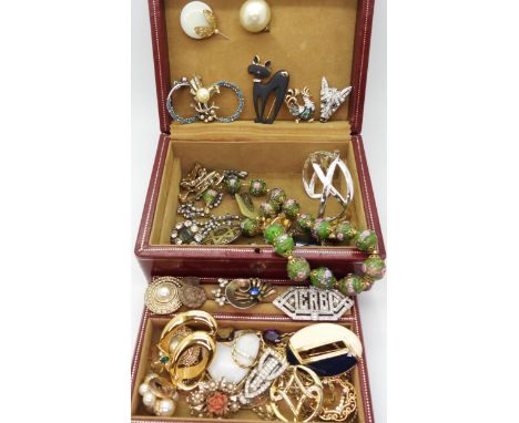 A red leather jewellery box filled with vintage costume to include A Butler &amp; Wilson dog brooch, a Attwood &amp; Sawyer c