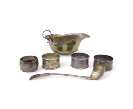 A collection of silver including a silver sauce boat, by Samuel M Levi, Birmingham 1928, four silver napkin rings, a Georgian