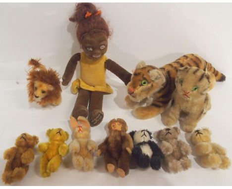 A small Steiff tiger, with button to ear, together with a small collection of further creatures, all unlabelled but possibly 