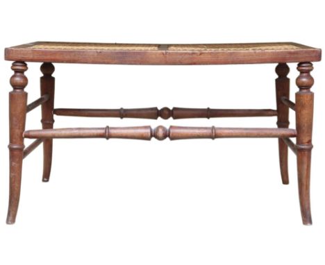 A 19th century bergere bench stool on turned supports joined by turned stretchers, 44cm high x 77cm wide x 43cm deep Conditio