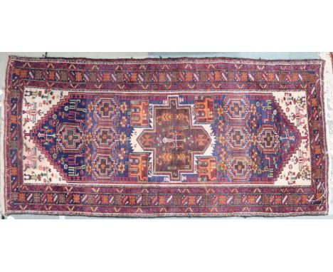 A light blue ground Hamadan rug with geometric central medallion, cream spandrels and multicoloured border, 219cm long x 106c