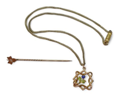 A 9ct Edwardian pendant with an enamelled flower set with a blue gem, on a vintage 39cm yellow metal chain, together with a 1