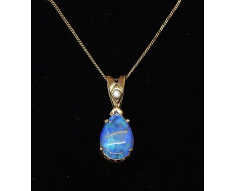 A 9ct gold black opal pendant with diamond accent, on a fine 9ct gold 46cm curb chain, weight 2.1gms Condition Report:Availab