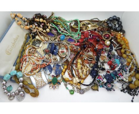 A collection of statement necklaces to include a lapis lazuli and green hardstone example, freshwater pearls with a 14k gold 