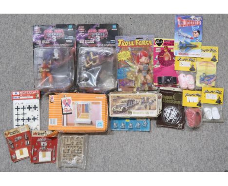 A mixed selection of vintage toys, including a packaged Sindy record player, various dolls' house accessories, two Tekken act