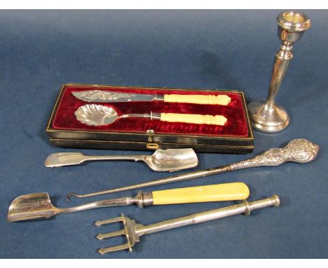 A mixed collection of silver and silver plate to include silver plated candlesticks, stilton scoop, silver collared lace hook