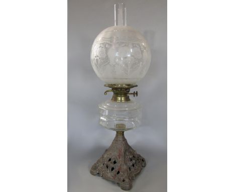 Edwardian cast iron and pressed glass oil lamp, 55cm high including flue 