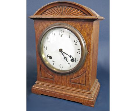 A Victorian oak Ansonia mantel clock, eight day, half hour strike, cathedral gong, Arabic numerals, made in the USA, twin tra