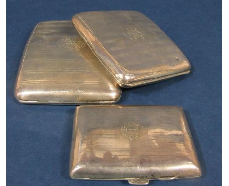 Three early 20th century silver engine turned cigarette cases, the largest 11.5 cm long, 9.5 oz approx (3) 