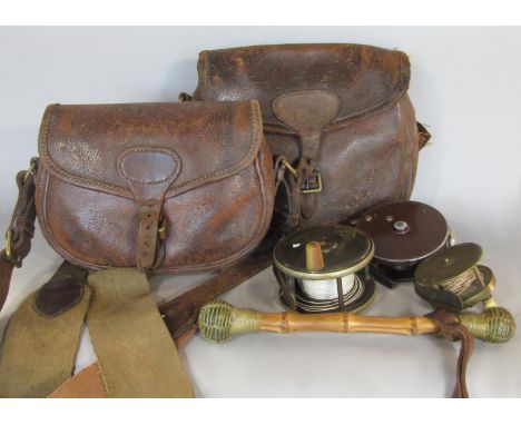 Two vintage leather fishing creel, three fishing reels of unknown make and a bamboo double headed priest (6) 