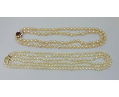 Double strand pearl necklace with 9ct garnet and pearl cluster clasp, maker 'TJ', Birmingham 1993 and a further triple strand