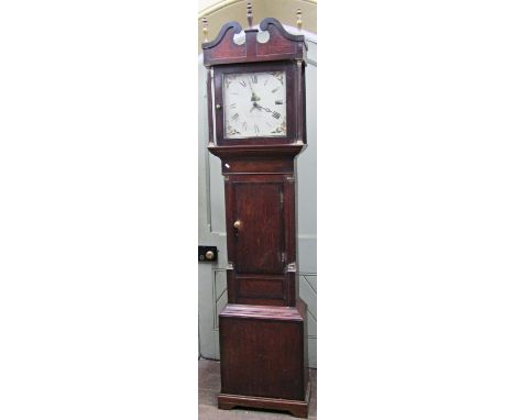 A Georgian oak longcase clock, the trunk with reeded and canted corners, the hood with further reeded columns, swan necked pe