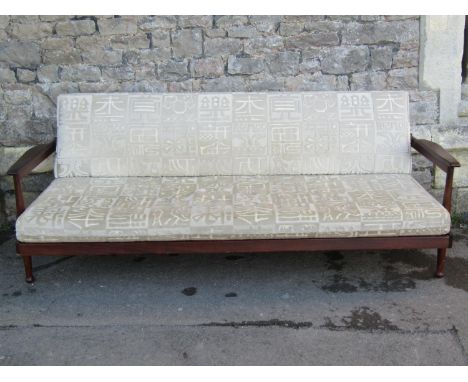 A 1960s Guy Rogers 'Manhattan' Afromosia three piece suite comprising three seat sofa/bed with re-upholstered loose seat cush