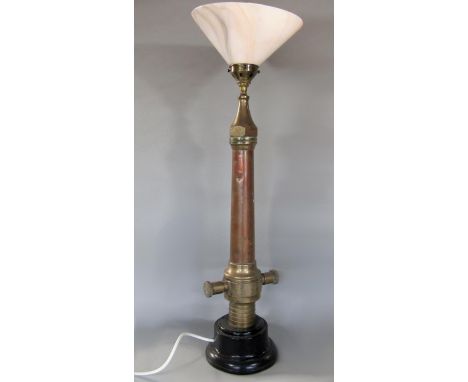Novelty table lamp constructed from an antique copper firehose, mottled glass shade, 79cm high 