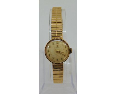 Vintage ladies Tissot 9ct dress watch, the champagne dial with Arabic numerals, 19mm case, upon a 9ct bracelet, 20.7g gross, 