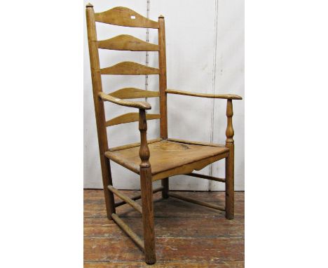 Georgian ashwood ladder back elbow chair, the solid seat on turned supports 