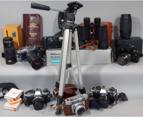 A collection of vintage cameras and equipment including Olympus OM10 and OM30 models, cased Adox, Canon EOS 500 Practica OM10