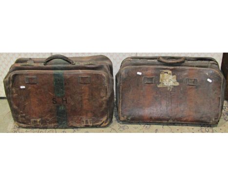 Two vintage brown stitched leather Gladstone type bags with brass fittings, together with two further vintage leather suitcas