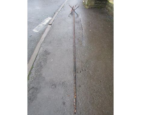 A vintage weather vane, the cut sheet metal finial in the form of two owls, raised on a tall cylindrical pole, 320 cm 