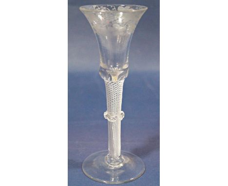 A Georgian stemmed wine glass, the bell shaped bowl etched with trailing foliate detail, with latticino twist stem and centra