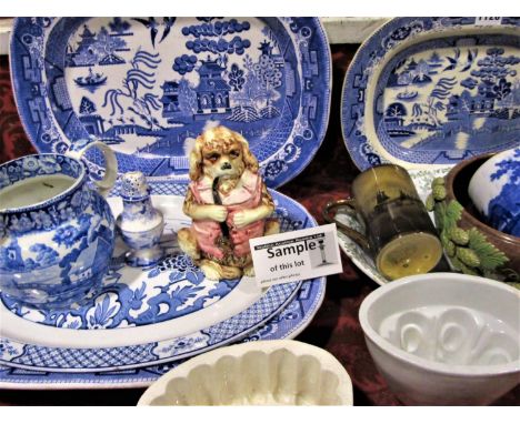A collection of 19th century and later ceramics including blue and white meat plates, blue and white printed jug, majolica bo