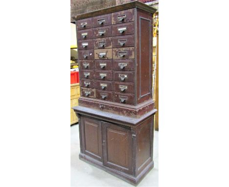 A vintage 'Shannon' steel filing cabinet fitted with twenty four index filing drawers, enclosing Shannon file binding cases, 